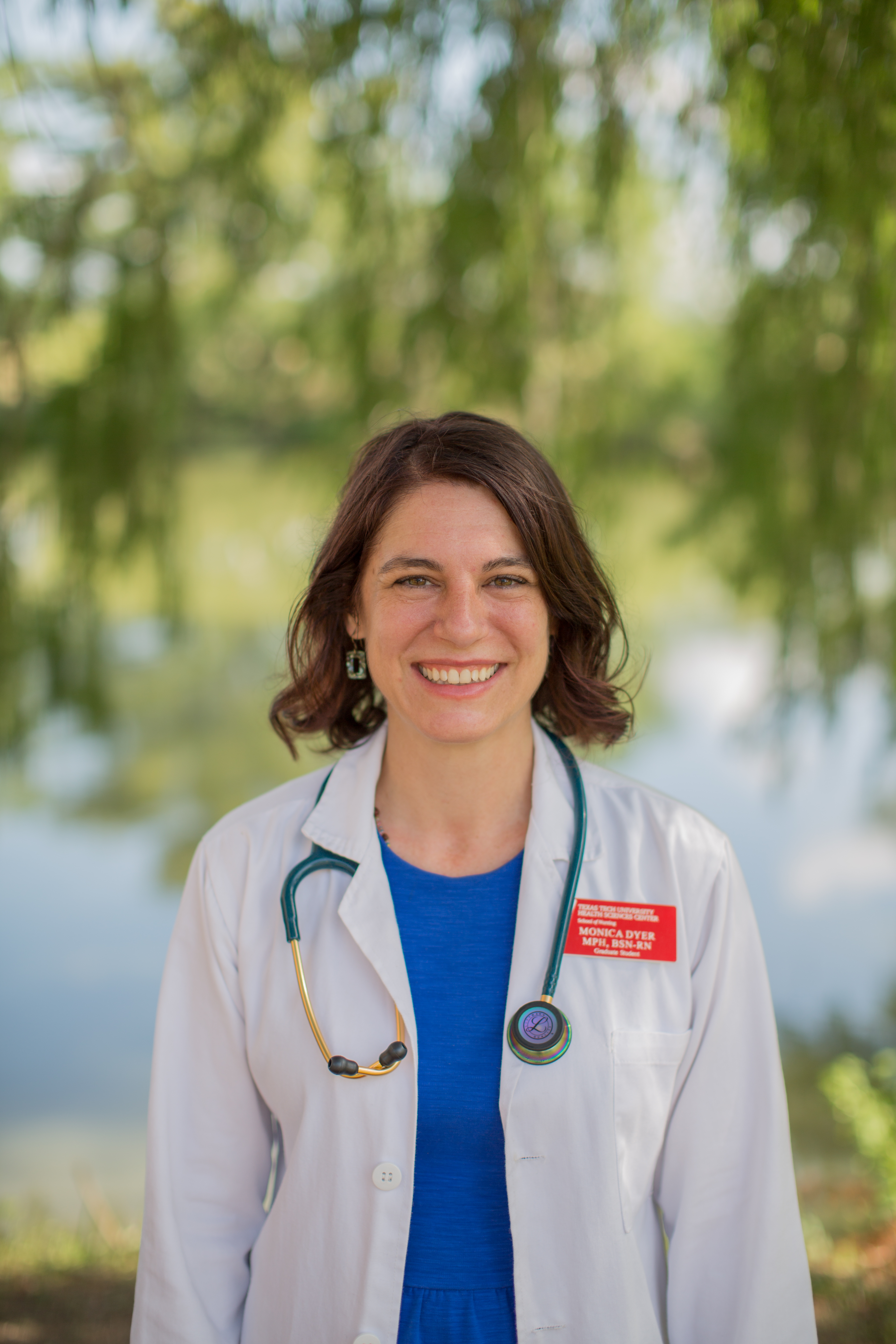 Dr. Monica Dyer, psychiatric-mental health nurse practitioner, smiling outdoors